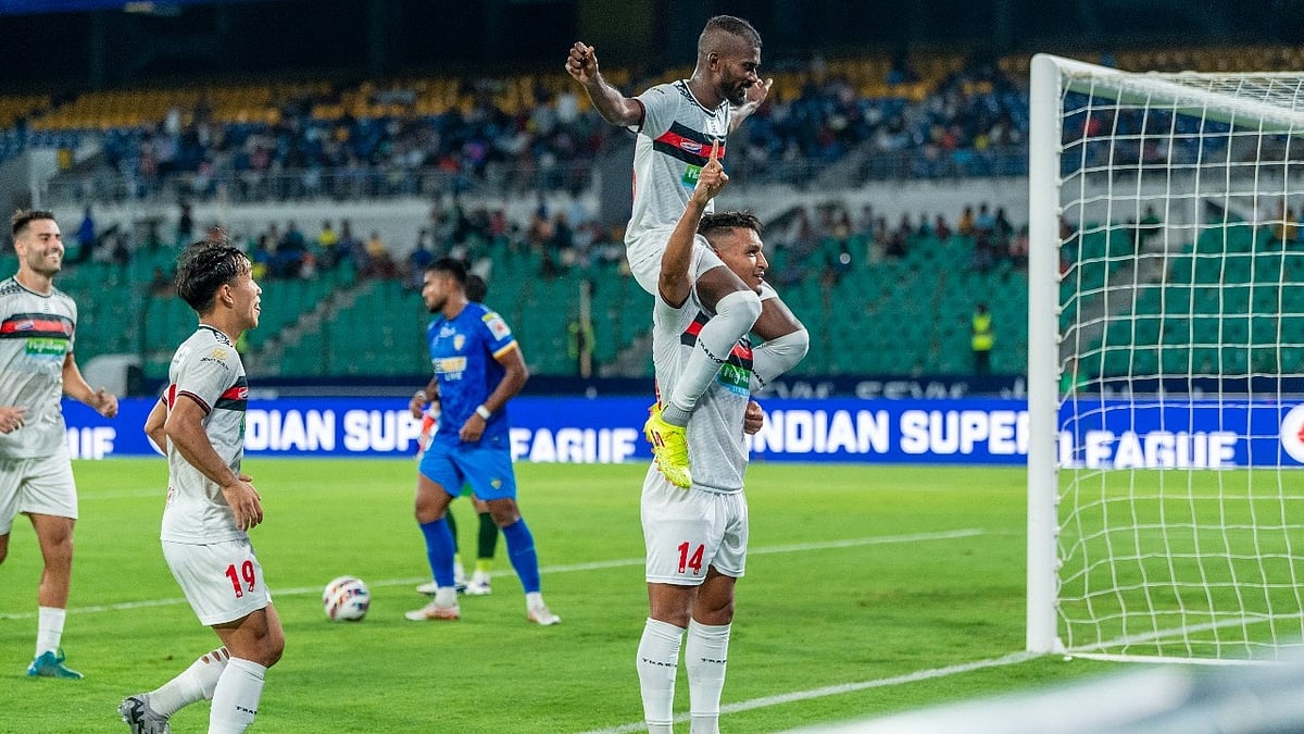 Photo: FSDL/ISL : Jithin MS (top) and Alaaeddine Ajaraie celebrate a NorthEast United goal against Chennaiyin FC.