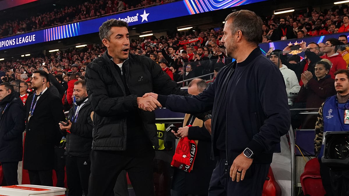 Bruno Lage and Hansi Flick share a handshake.