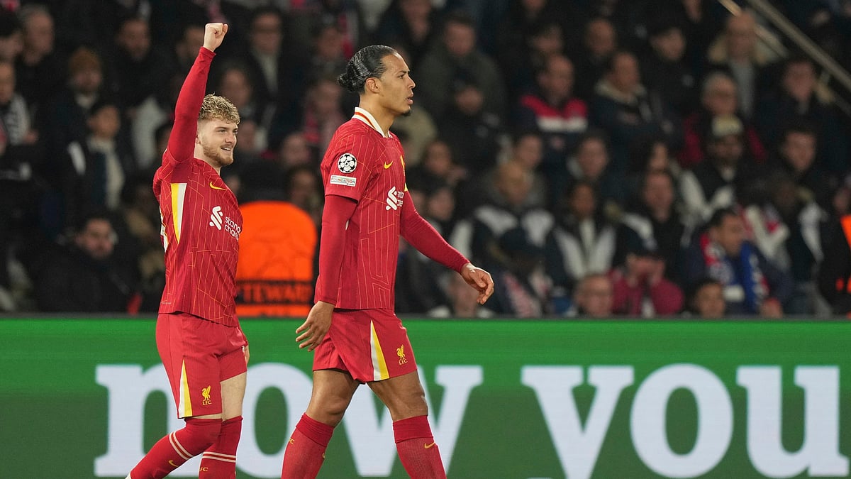 (AP Photo/Aurelien Morissard) : Liverpool's Harvey Elliott, left, celebrates with Virgil van Dijk after scoring the opening goal during the Champions League round of 16 first leg soccer match.