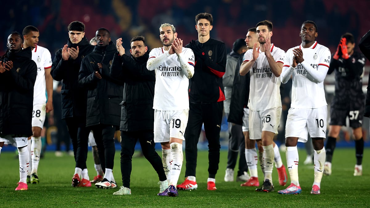 Milan's players celebrate after their victory against Lecce