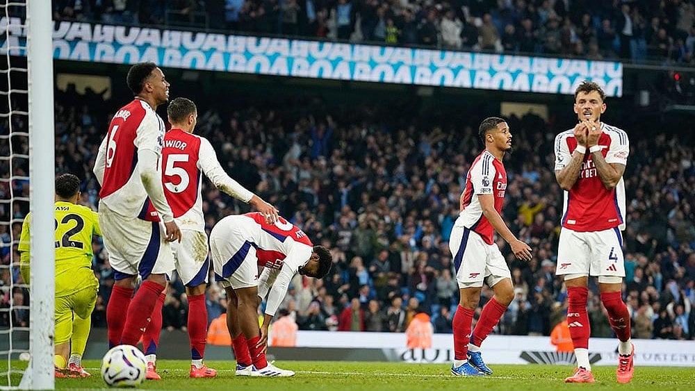 Photo: AP/Dave Thompson : Arsenal in action at the English Premier League