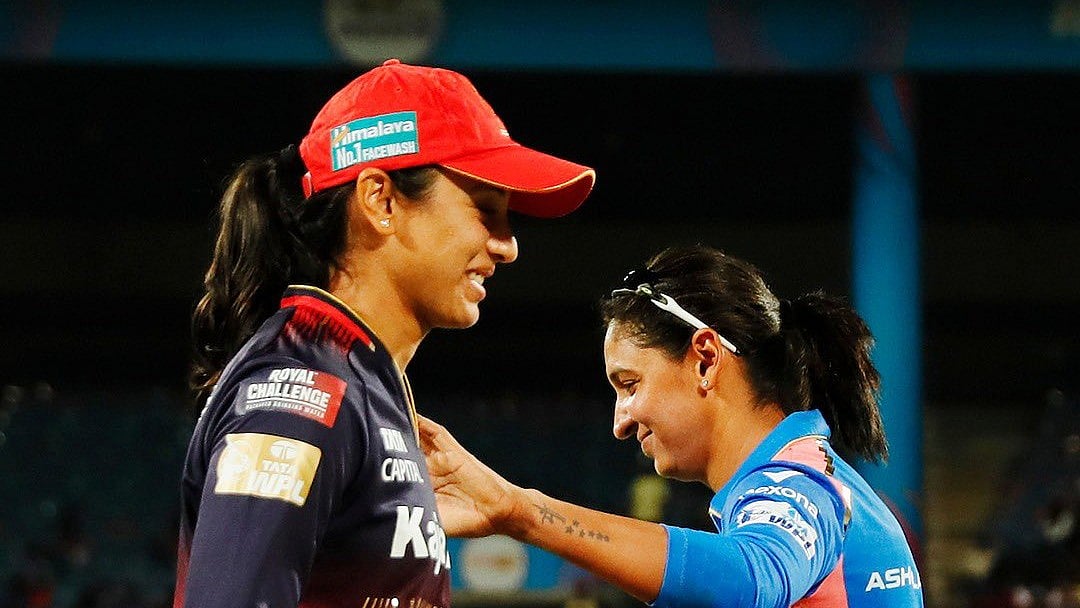 Photo: X | Mumbai Indians : Mumbai Indians women captain Harmanpreet Kaur and Royal Challengers Bengaluru skipper Smriti Mandhana during the toss before the WPL match.