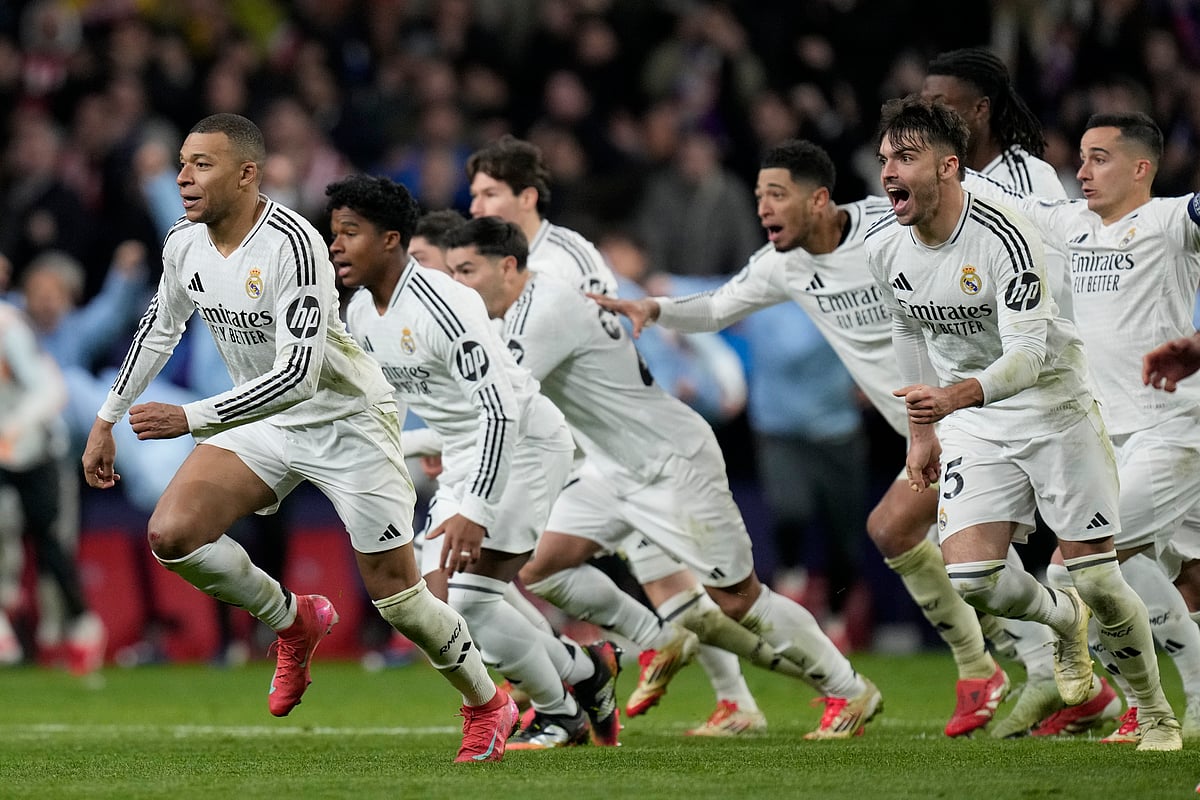  (AP Photo/Bernat Armangue)
 : Real Madrid players celebrate after winning the penalty shootout during the Champions League round of 16, second leg, soccer match between Atletico Madrid and Real Madrid at the Metropolitano stadium in Madrid, Spain, Wednesday, March 12, 2025.

