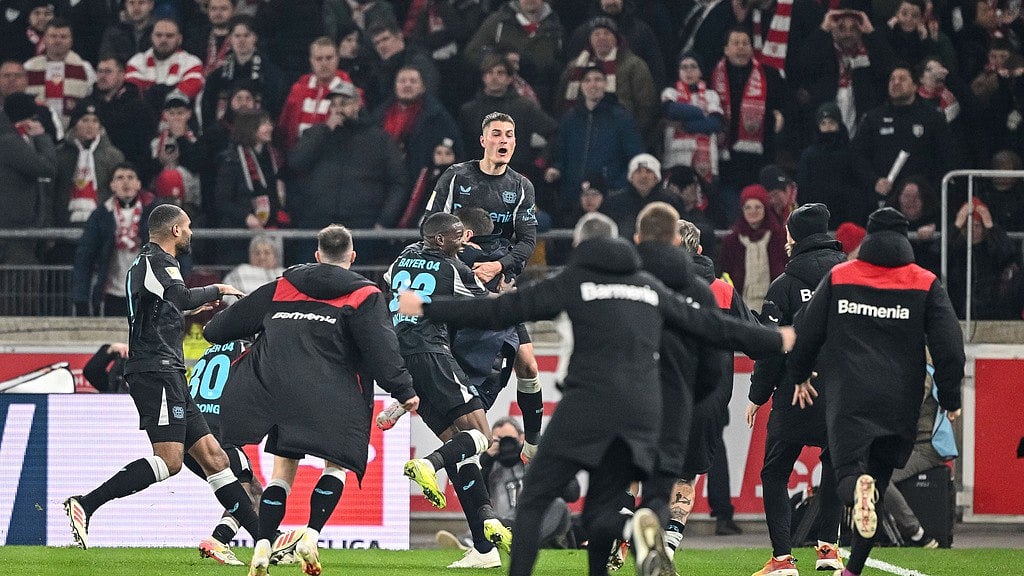 Harry Langer/dpa via AP : Leverkusen's Patrick Schick and the team celebrate during the German Bundesliga soccer match between VfB Stuttgart and Bayer Leverkusen at the MHP Arena in Stuttgart, Germany, Sunday, March 16, 2025.