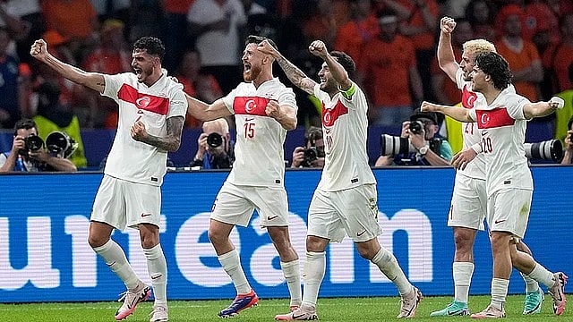 AP : File photo of Turkey's Samet Akaydin, left, celebrates with teammates after scoring a goal against Netherlands at the Euro 2024 tournament.
