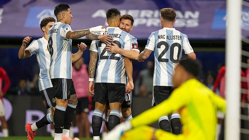 | Photo: AP/Natacha Pisarenko : Football World Cup 2026 Qualifiers: Argentina's Lionel Messi embraces Lautaro Martinez after scoring opening goal