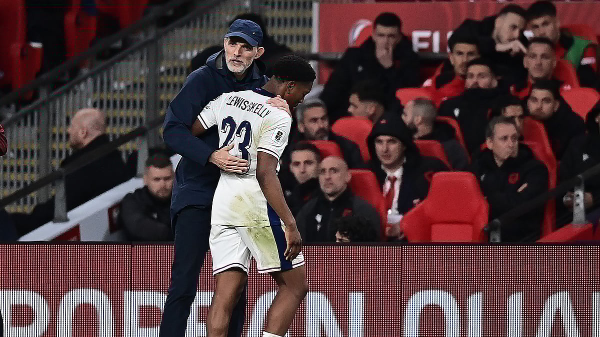 England goalscorer Myles Lewis-Skelly with boss Thomas Tuchel.