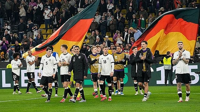AP : Germany celebrate after beating Italy in the UEFA Nations League quarter-finals.