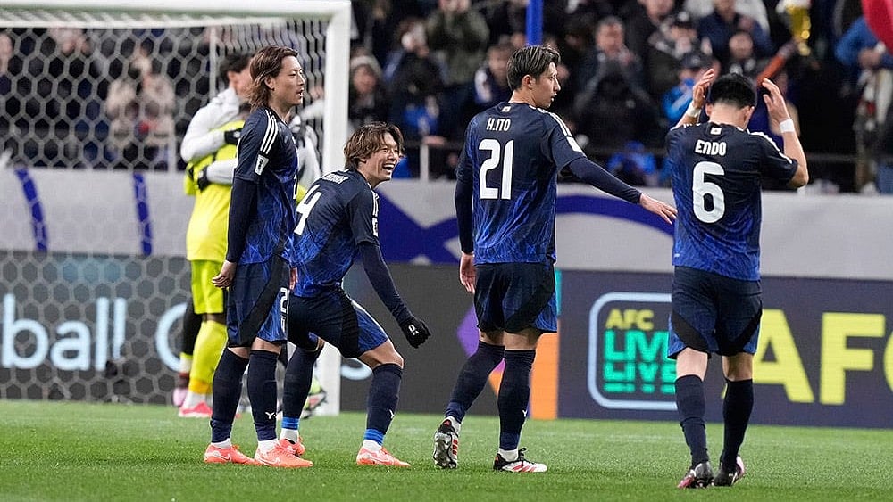 | Photo: AP/Eugene Hoshiko : AFC World Cup Qualifiers: Japan vs Bahrain