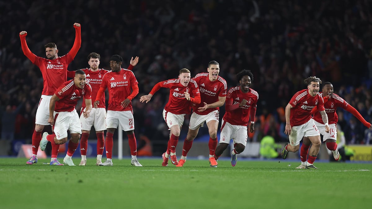 Forest celebrate Yates' winning penalty.