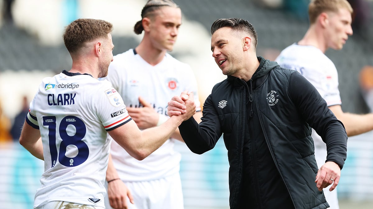 Matthew Bloomfield and Jordan Clark celebrate after Luton's win at Hull