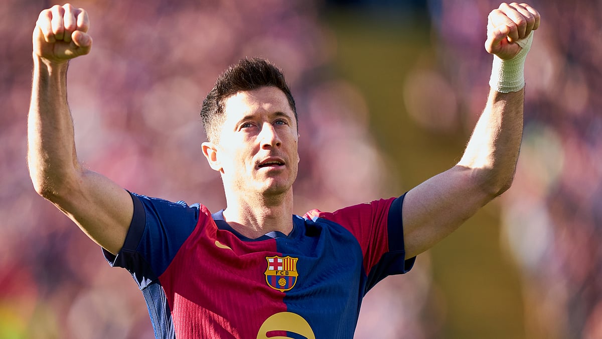 Robert Lewandowski celebrates his second goal against Girona