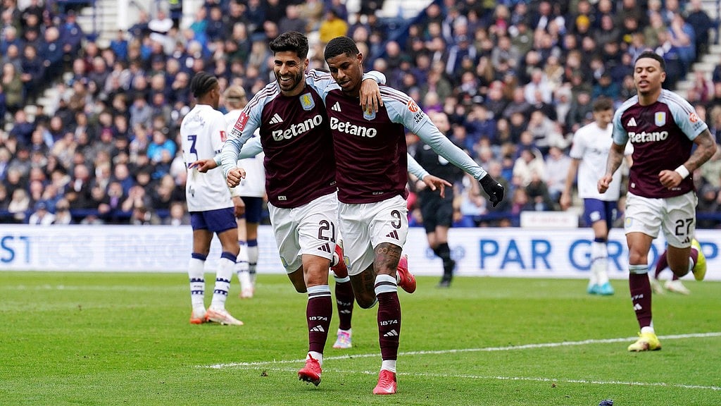 Photo: AP : Aston Villa's Marcus Rashford, centre right, celebrates scoring their side's first goal of the game with teammate Marco Asensio during the FA Cup quarter-final.