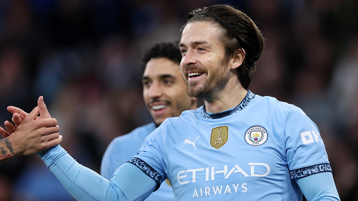 Jack Grealish celebrates after scoring against Leicester City.