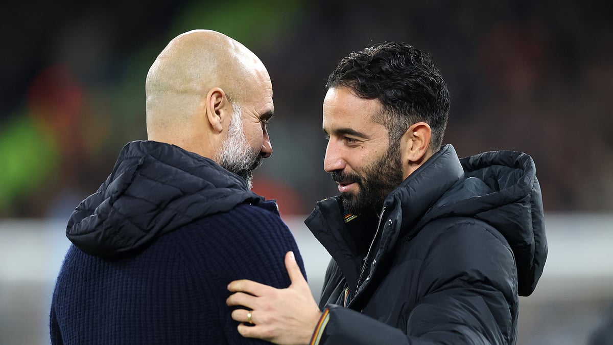 Ruben Amorim and Pep Guardiola embrace at the Etihad