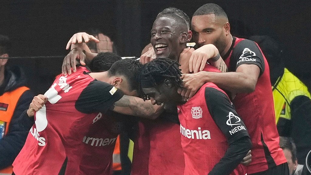 AP : Bayer Leverkusen players celebrate a goal during their Bundesliga match against VfL Bochum.
