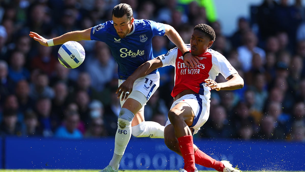 Myles Lewis-Skelly fouls Jack Harrison for Everton's penalty