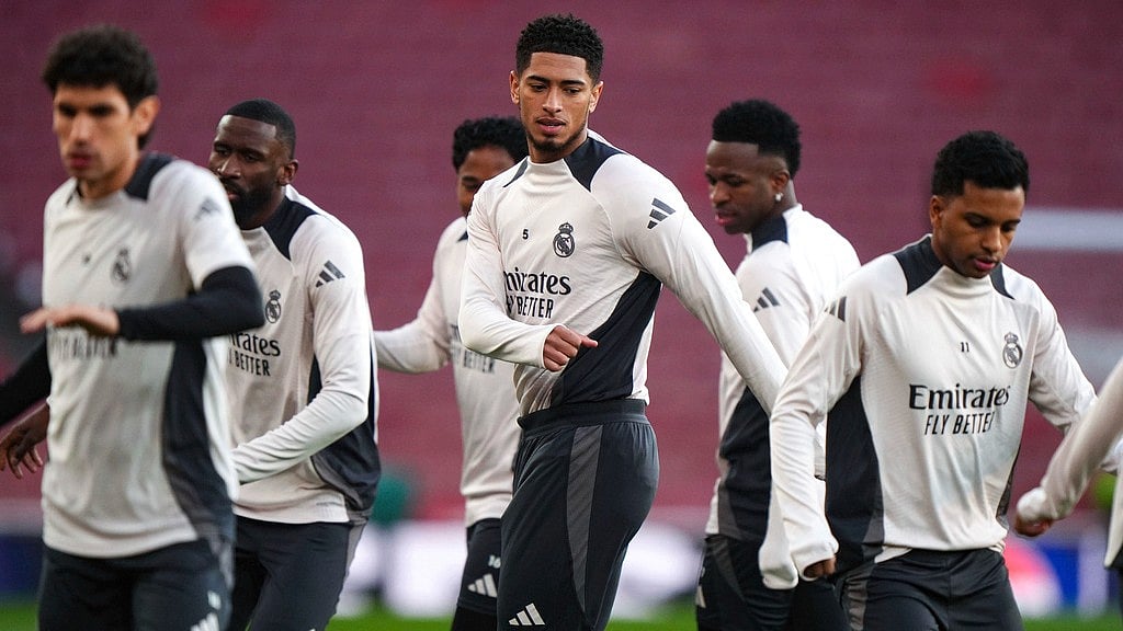 AP : Real Madrid's Jude Bellingham, centre, Vinicius Junior, centre right and teammates take part in a training session at the Emirates Stadium, ahead of the 1st leg Champions League match against Arsenal.