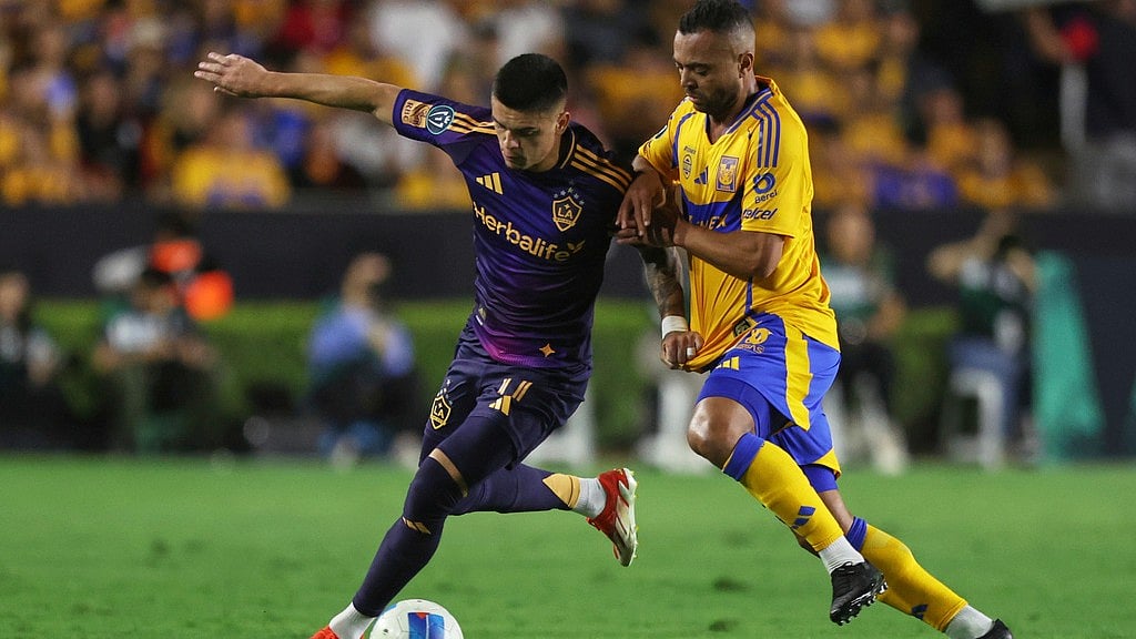 AP : Gabriel Pec of the United States' LA Galaxy, left, and Rafael De Souza of Mexico's Tigres battle for the ball during a CONCACAF Champions Cup second leg quarterfinal match.