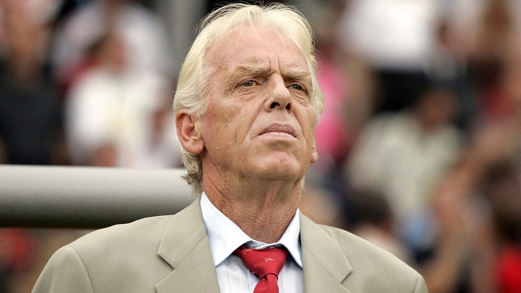 AP : Trinidad and Tobago's coach Leo Beenhakker listens to the national anthems before their World Cup Group B soccer match against England in Nuremberg.