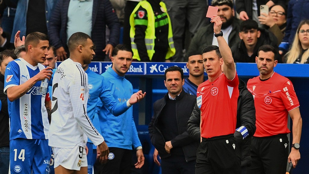 AP/Miguel Oses : Kylian Mbappe is shown straight red for this during Real Madrid's game with Deportivo Alaves.