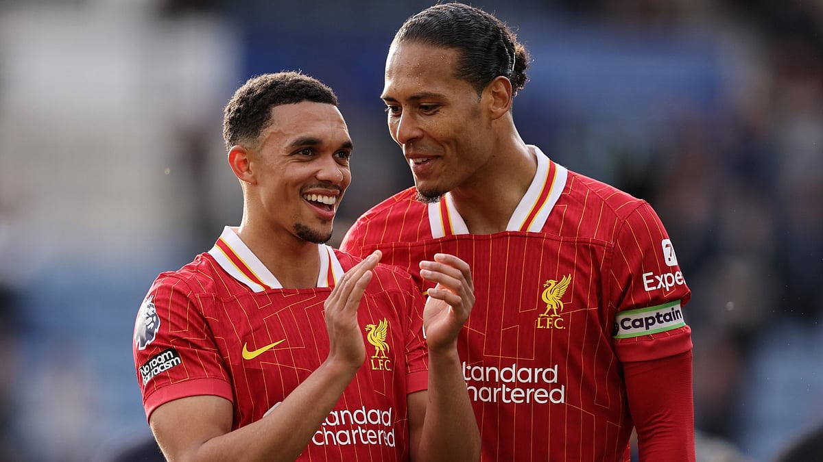Trent Alexander-Arnold and Virgil Van Dijk chat after Liverpool beat Leicester 1-0 to stand on the brink of the Premier League title.