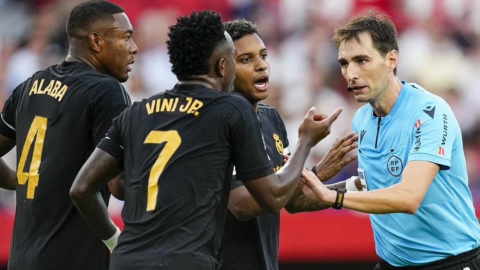 AP : FILE - Referee Ricardo De Burgos Bengoetxea, right, discusses with Real Madrid players during a Spanish La Liga soccer match between Sevilla and Real Madrid, at the Ramon Sanchez Pizjuan stadium in Seville, Spain, Saturday