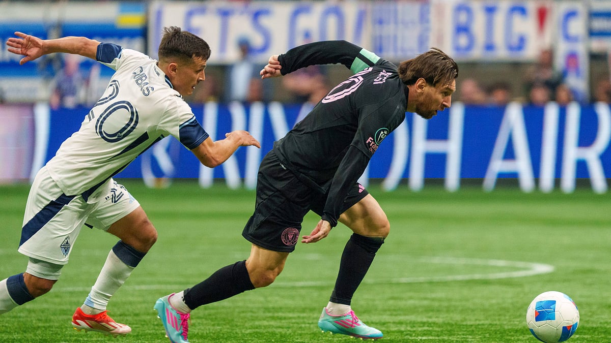 Christopher Morris/The Canadian Press via AP : Inter Miami's Lionel Messi, right, is pursued by Vancouver Whitecaps' Andres Cubas during their CONCACAF Champions Cup 2025 semi-final first leg match in Vancouver, British Columbia on April 24, 2025.