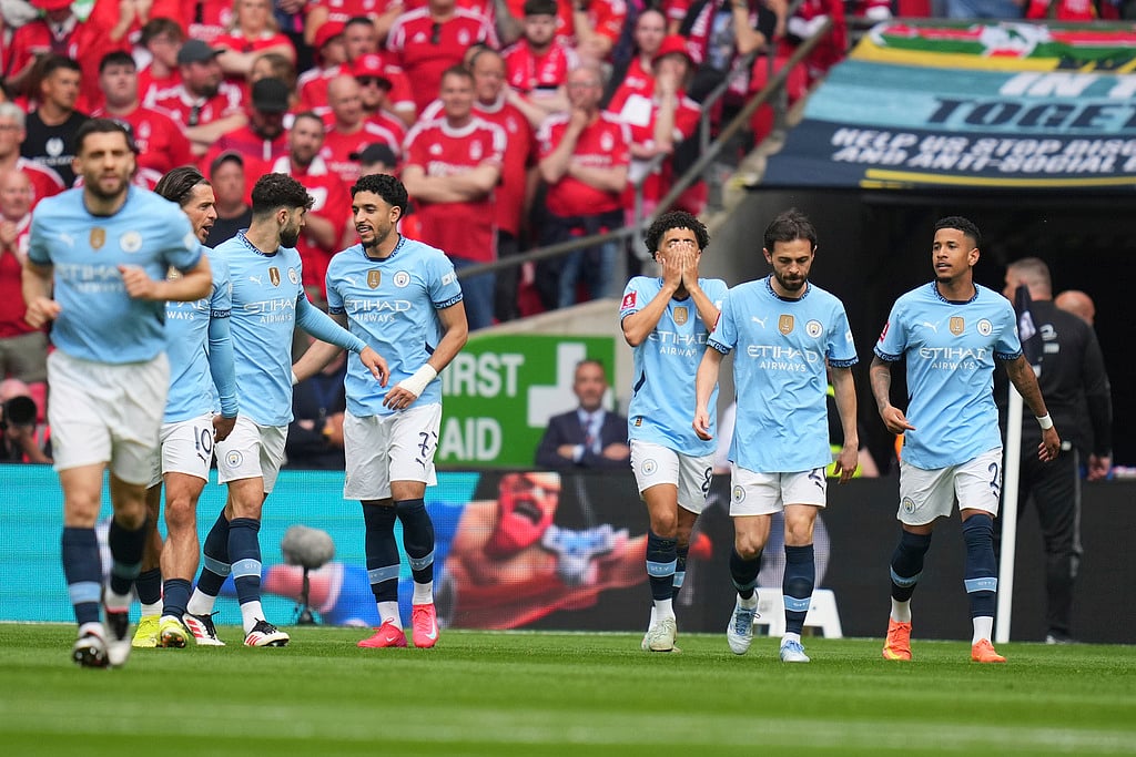 AP/Kirsty Wigglesworth : Manchester City players celebrate after a goal during the English FA Cup semifinal.
