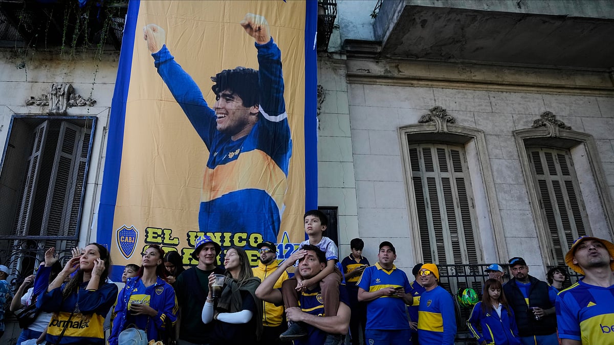 (AP Photo/Natacha Pisarenko)

 : Boca Juniors fans watch their team play a local tournament soccer league match against River Plate, in front of a banner of soccer legend Diego Maradona, in La Boca neigborhood in Buenos Aires, Argentina, Sunday, April 27, 2025.
