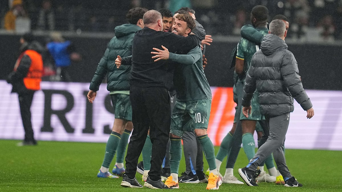 Tottenham Hotspur's Ange Postecoglou and James Maddison