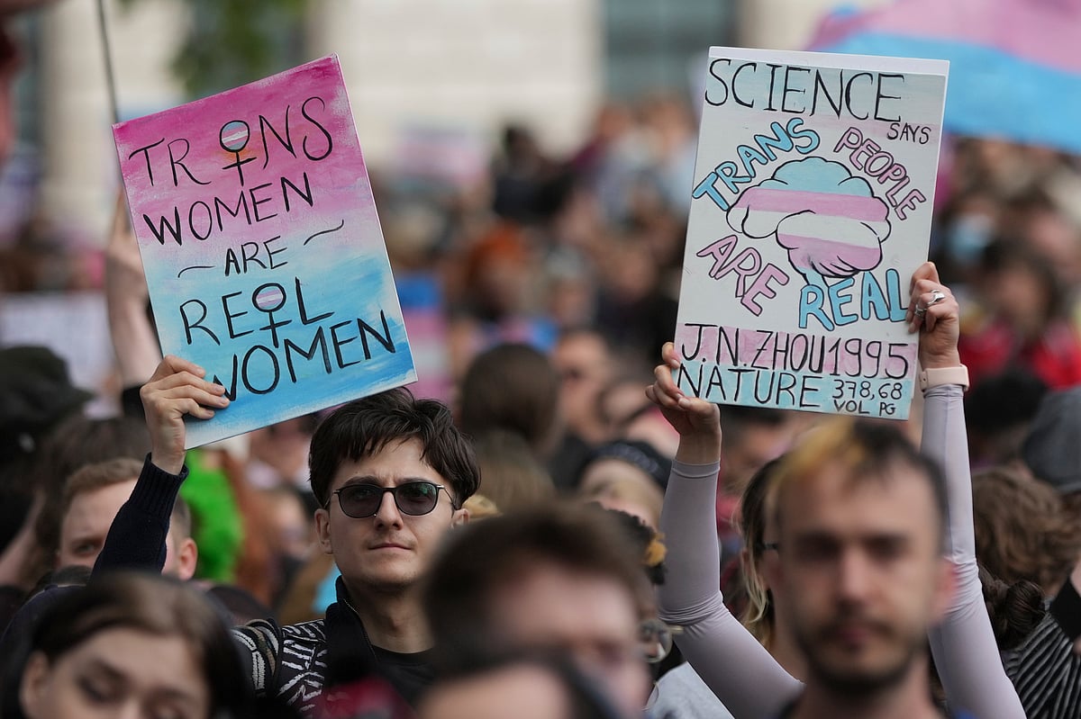 (AP Photo/Alastair Grant, File) : FILE - Campaigners take part in a rally organised by trans rights groups, trade unions, and community organisations following the Supreme Court ruling on the definition of a woman in equalities law, at Parliament Square, central London, Saturday April 19, 2025.
