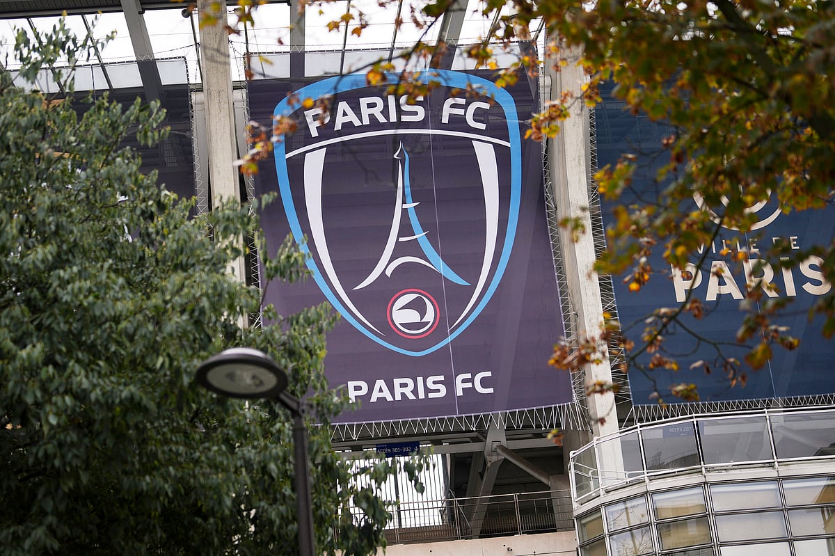  (AP Photo/Thibault Camus, File) : FILE - The Paris FC soccer club banner is seen outside the Charlety stadium in Paris, France, Thursday, Oct.17, 2024.