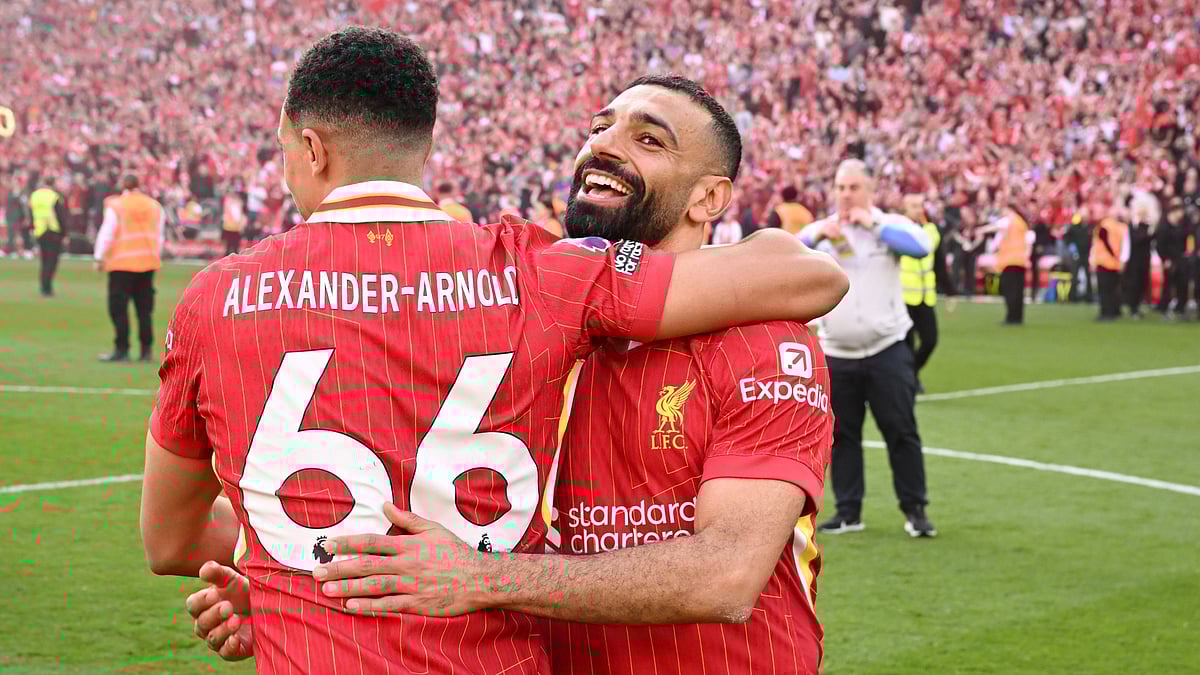 Mohamed Salah and Trent Alexander-Arnold celebrate Liverpool's title triumph