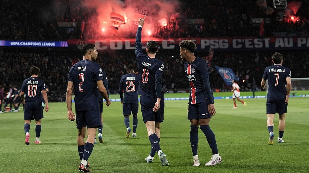 AP : Paris St-Germain players celebrate the goal against Arsenal in the Champions League.