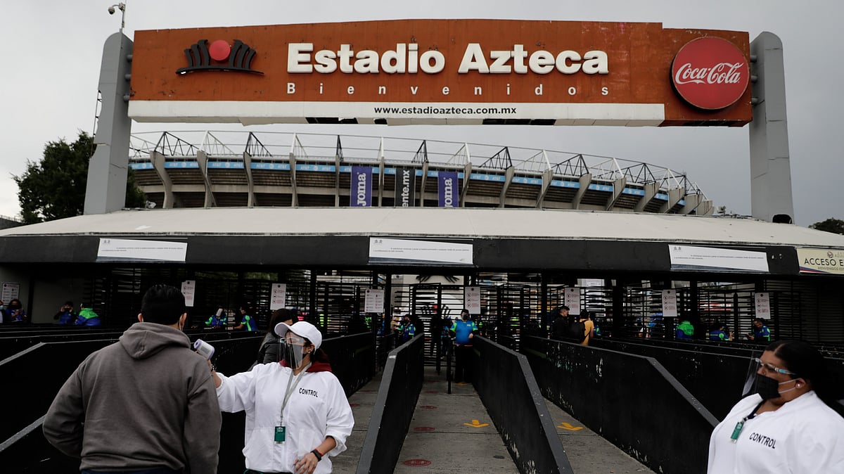 (AP Photo/Eduardo Verdugo, File)


 : FILE - A fan gets his temperature checked as he enters Azteca Stadium before a Mexican soccer league quarterfinal second leg soccer match between Cruz Azul and Toluca in Mexico City, May 15, 2021. 