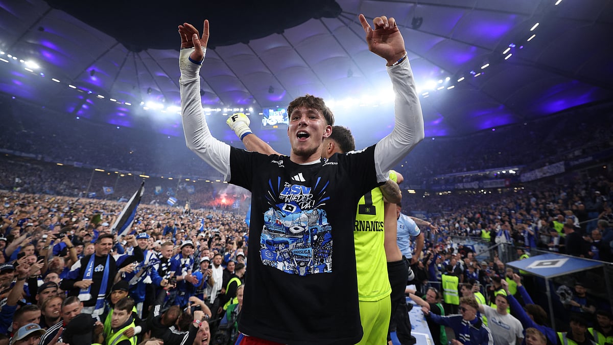 HSV forward Otto Stange leads the celebrations as fans flood the pitch