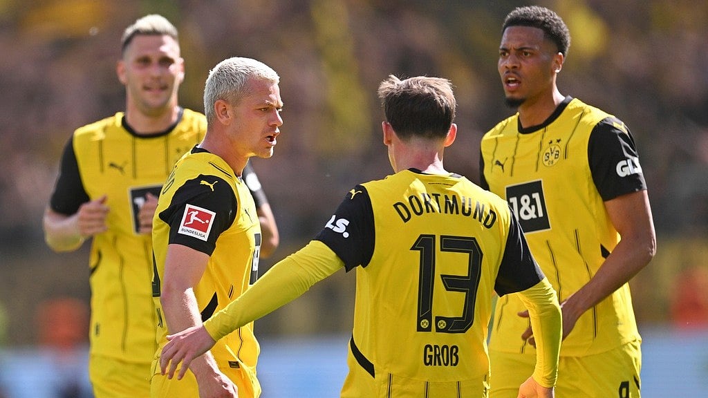 | Photo: AP/Marius Becker : Borussia Dortmund's Julian Ryerson celebrates after scoring his side's second goal against Bayer Leverkusen during the German Bundesliga match.