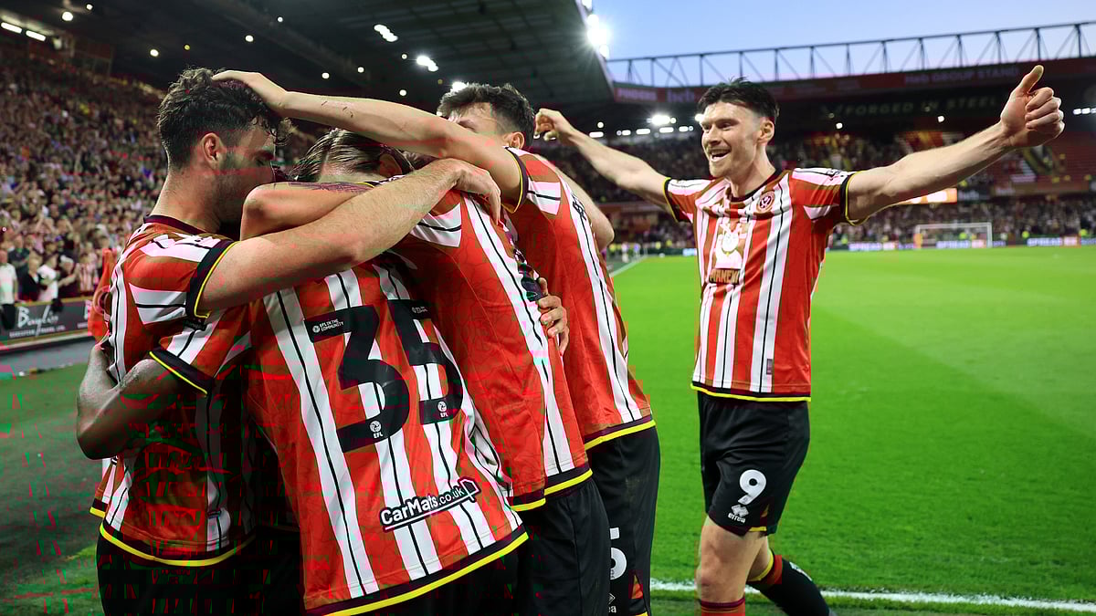 Kieffer Moore and Sheffield United team-mates celebrate their second goal on Monday