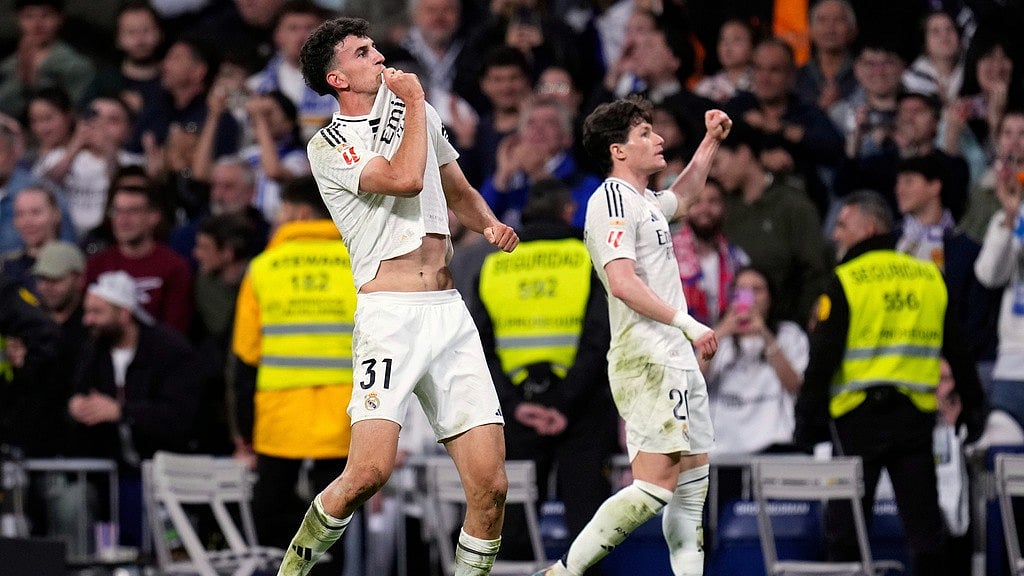 Photo: AP : Real Madrid's Jacobo Ramon, left, celebrates with Fran Garcia after scoring his side's second goal during their La Liga match against Mallorca.