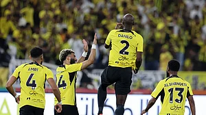 Photo: X | Al-Ittihad Club : Al-Ittihad players celebrating a goal against Al-Raed during a Saudi Pro League match.