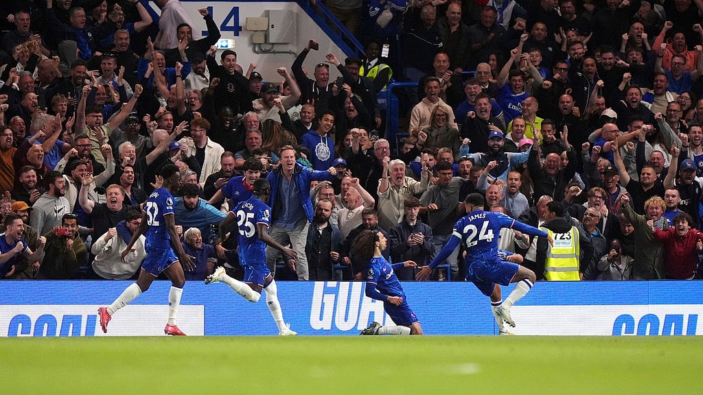 Photo: Bradley Collyer/PA via AP : Chelsea's Marc Cucurella, bottom centre, celebrates scoring his side's winning goal during the English Premier League match against Manchester United at Stamford Bridge, London.