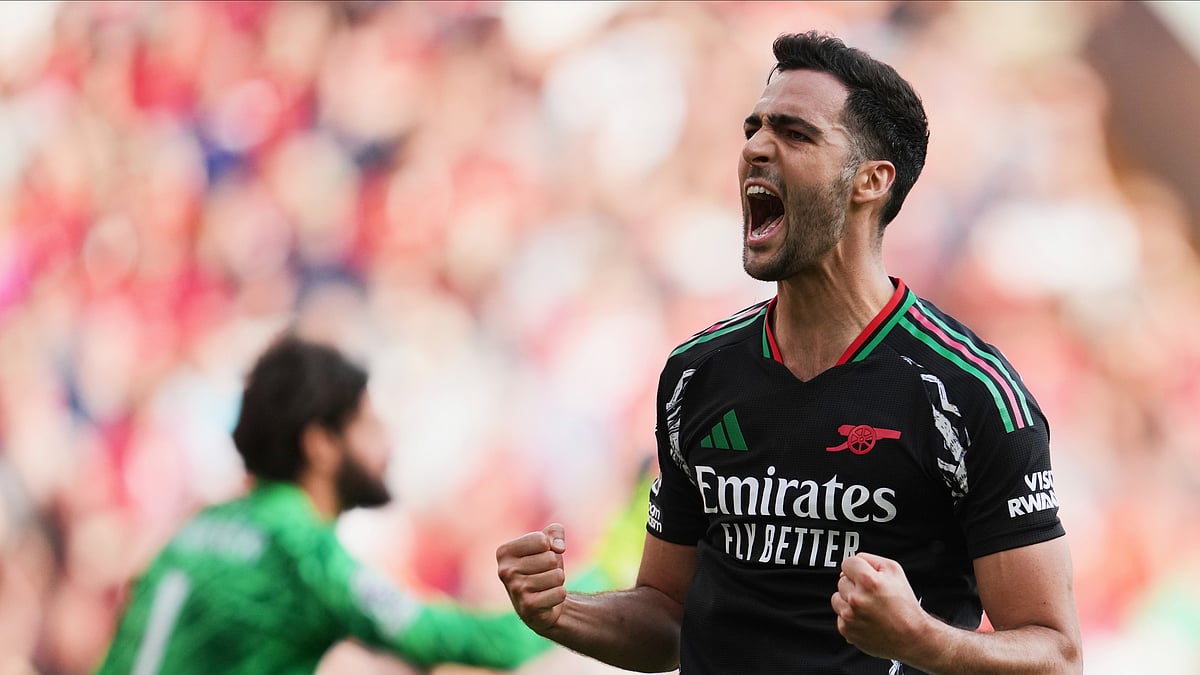 AP Photo/Jon Super : Arsenal's Mikel Merino celebrates after scoring his side's second goal during the English Premier League soccer match between Liverpool and Arsenal, at Anfield stadium in Liverpool, England.