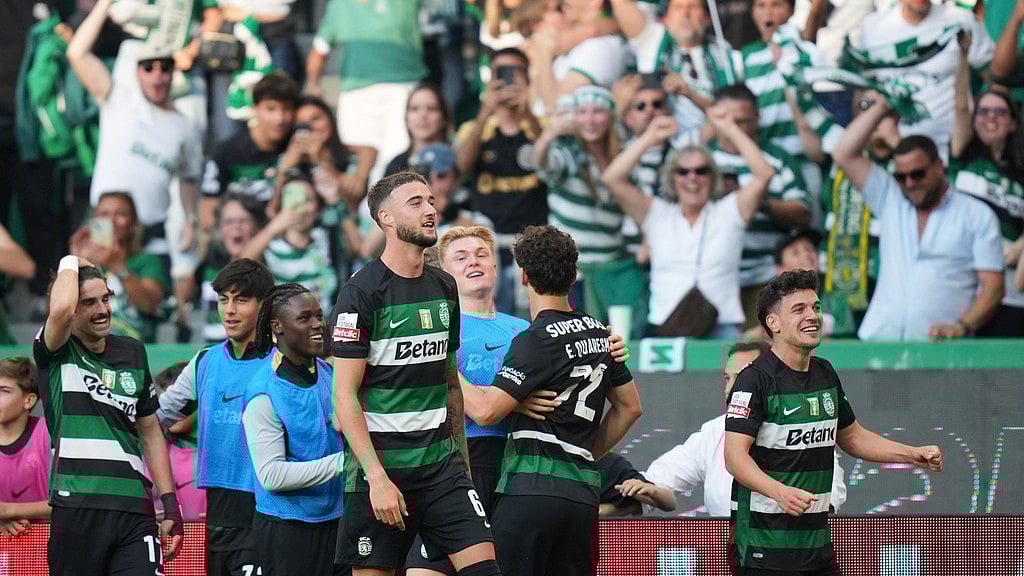 Photo: AP : Sporting Lisbon's Pedro Goncalves, right, celebrates after scoring their opening goal during the Portuguese league last-round match against Vitoria SC.