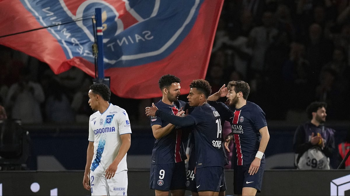 AP/Christophe Ena : Goalscorer Khvicha Kvaratskhelia, right, is congratulated by PSG teammates during their French Ligue 1 match against Auxerre at the Parc des Princes Stadium in Paris on May 17, 2025.