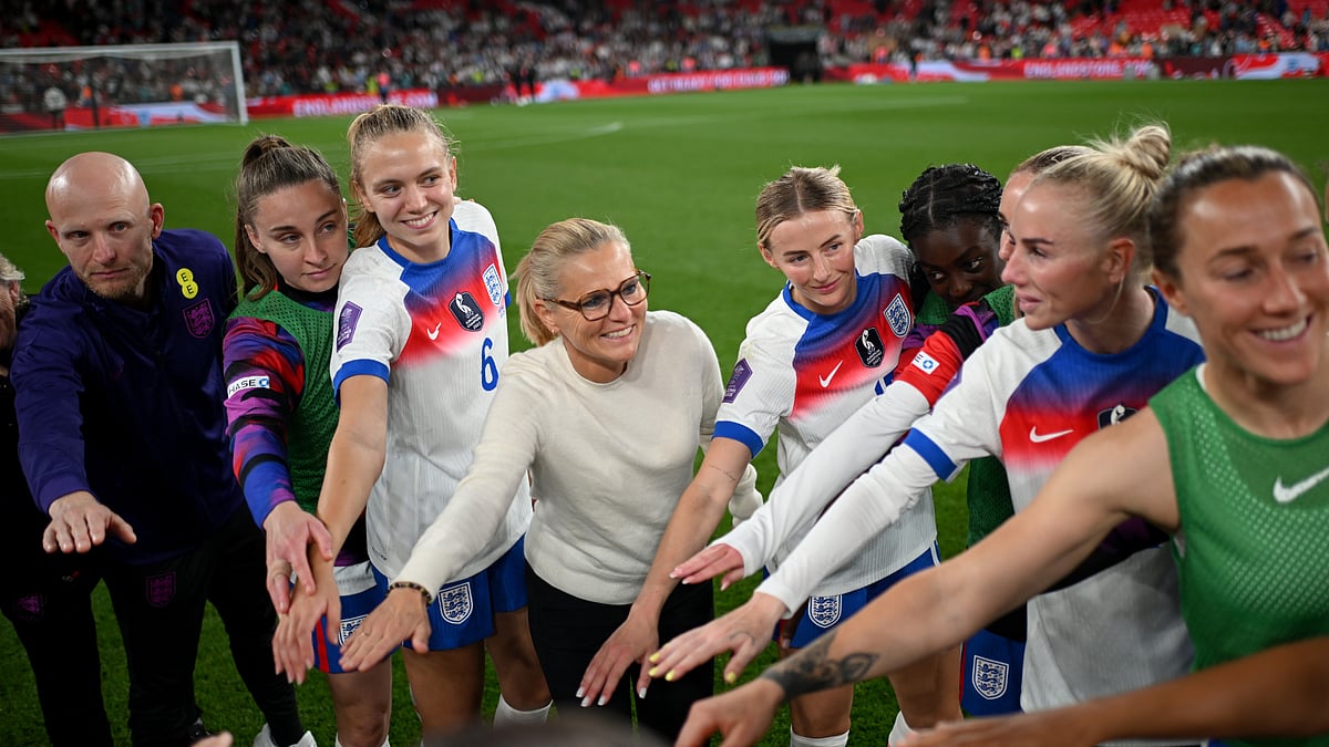 Sarina Wiegman celebrates with her England squad on Friday.