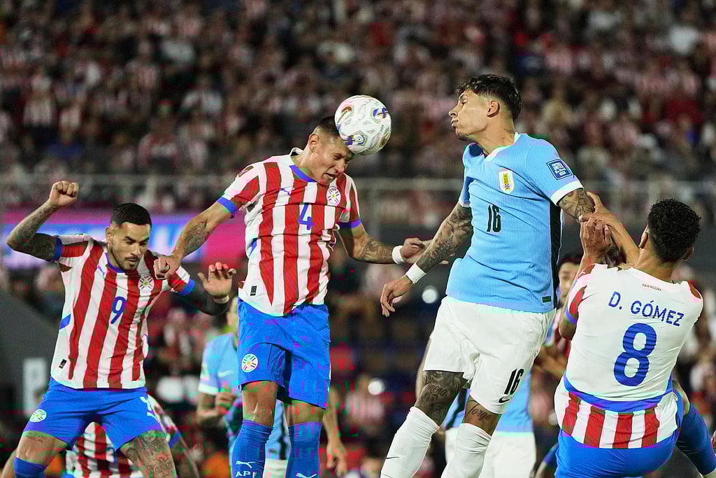 AP/Jorge Saenz : Uruguay's Mathias Olivera (16) and Paraguay's Juan Jose Caceres go for a header during a qualifying soccer match for the FIFA World Cup 2026 in Asuncion, Paraguay.