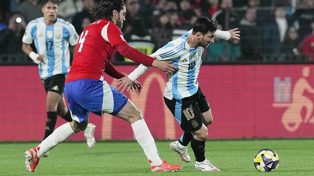 AP/Luis Hidalgo : Argentina's Lionel Messi, right, and Chile's Francisco Sierralta battle for the ball during a qualifying soccer match for the FIFA World Cup 2026 in Santiago, Chile, Thursday, June 5, 2025.