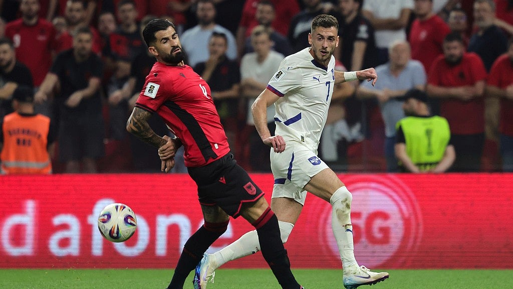 AP : Serbia's Aleksa Terzić, right, fights for the ball against Albania's Elseid Hysaj during the World Cup 2026 group K qualifying soccer match between Albania and Serbia, at Air Albania stadium.