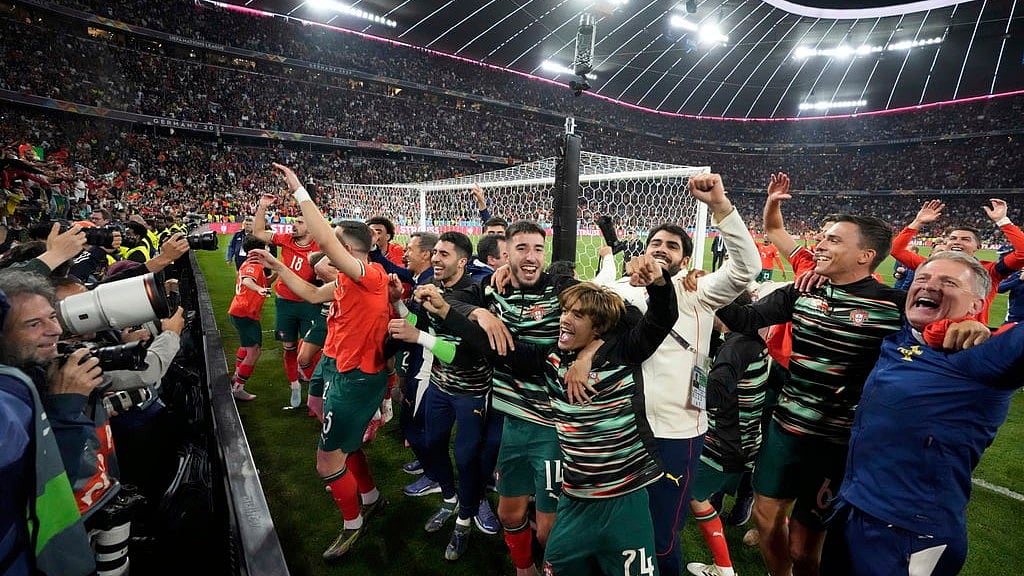 AP/Martin Meissner : Portugal players celebrate after winning the Nations League final soccer match between Portugal and Spain at the Allianz Arena in Munich, Germany.